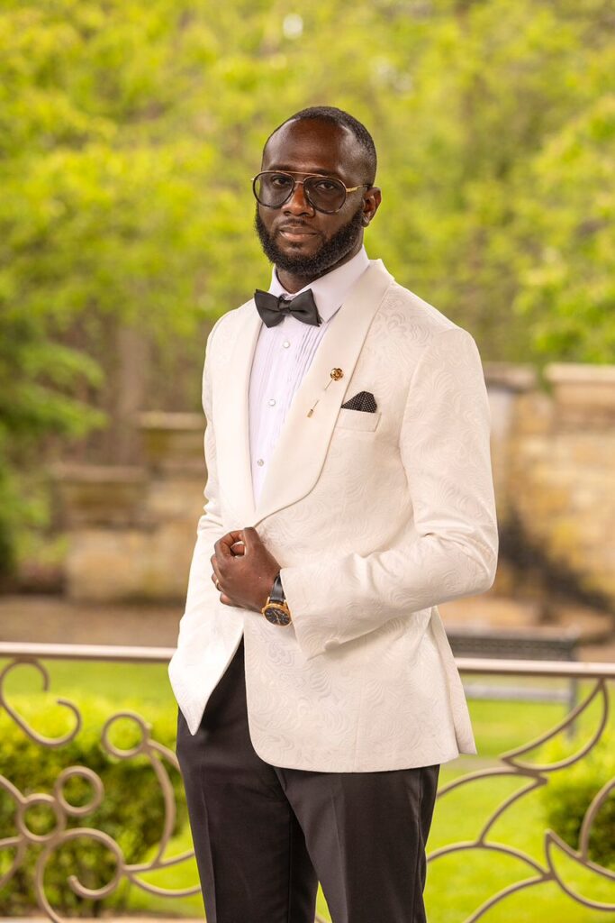 A groom in a white suit