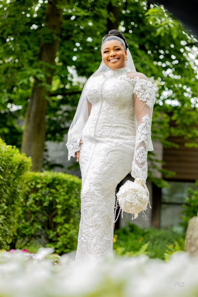 A portrait image of a smiling bride.