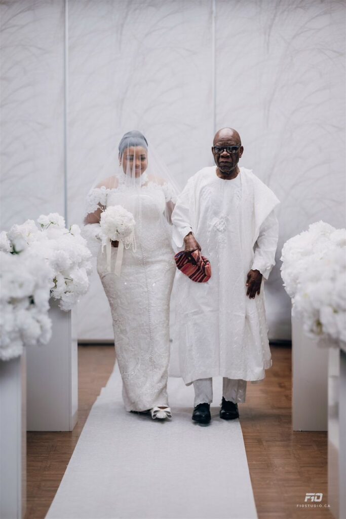 Bride walking down the aisle with her father.