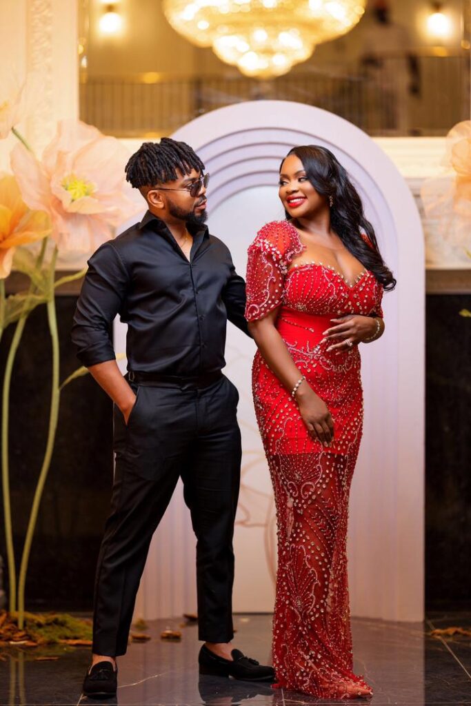 A bride in a red dress and a groom