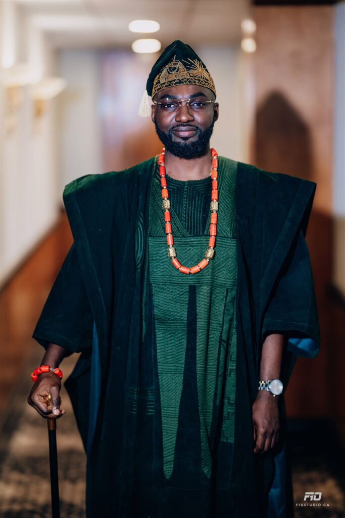 A groom in green traditional outfit