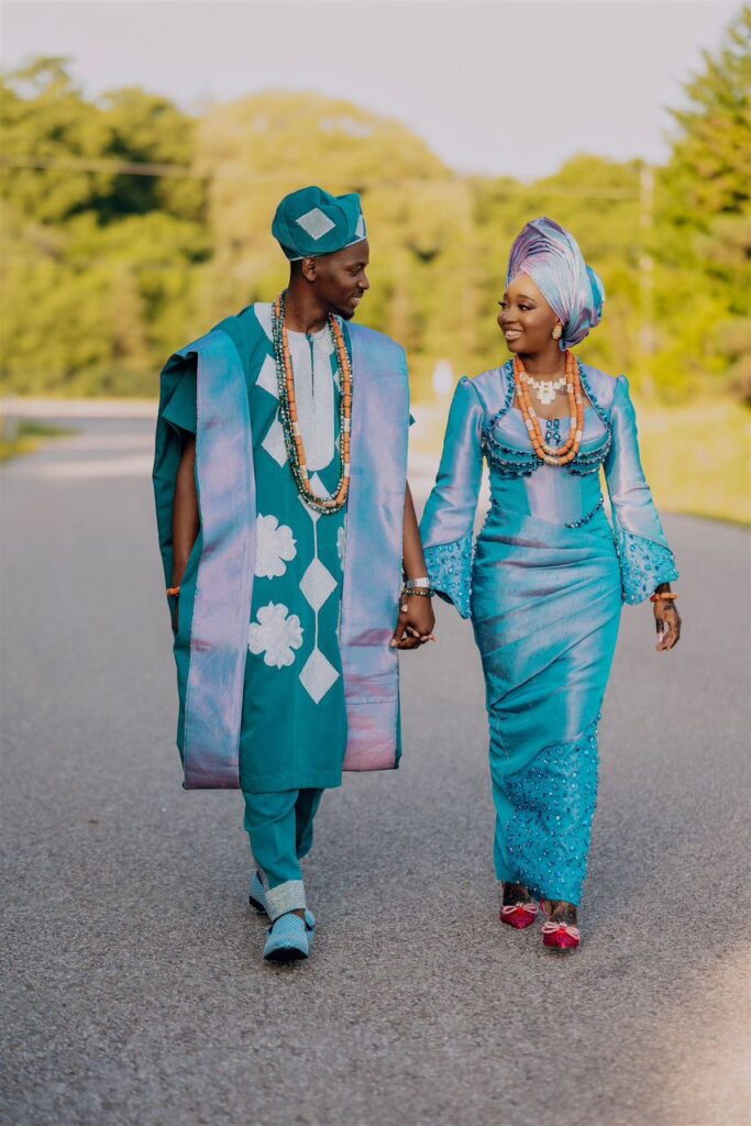 A bride and groom outdoor in their traditional attire