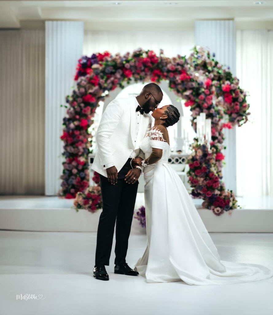 A couple in their white wedding utfit