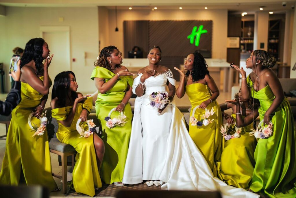 A bride and her bridesmaids holding her bouquets