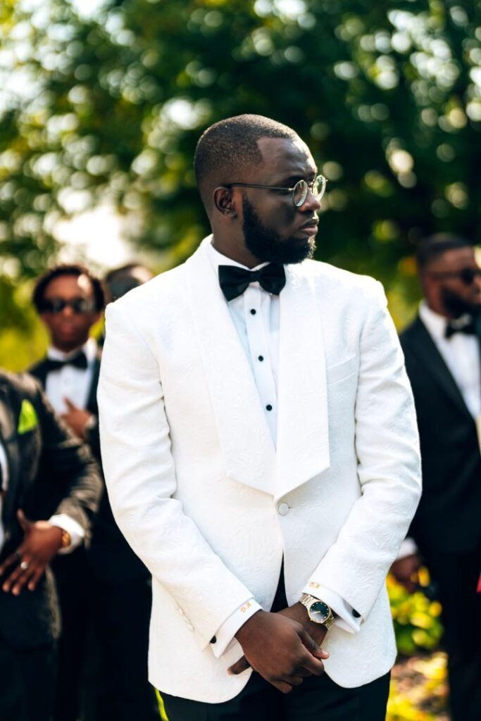 A Groom in a white suit